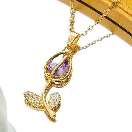 Gold-coloured zircon tulip pendant necklace on an adjustable O-ring chain, shown in pink, yellow, purple, green, and white colour variations.