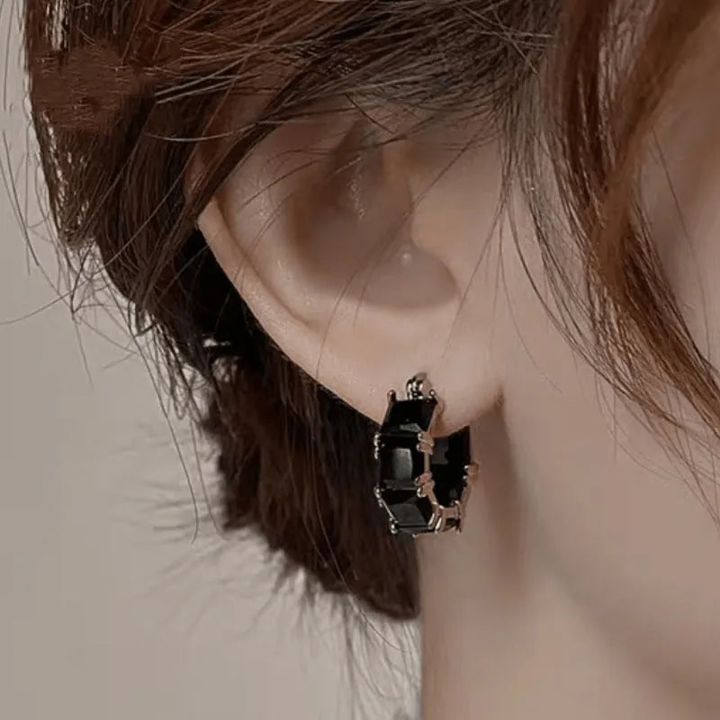 Gold-plated geometric ear ring with U-shaped design and round elements