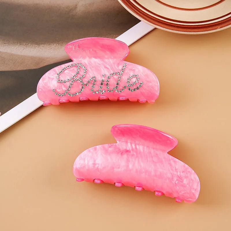 Acrylic hair clip with spot drill decoration in pink or white, 10cm long.