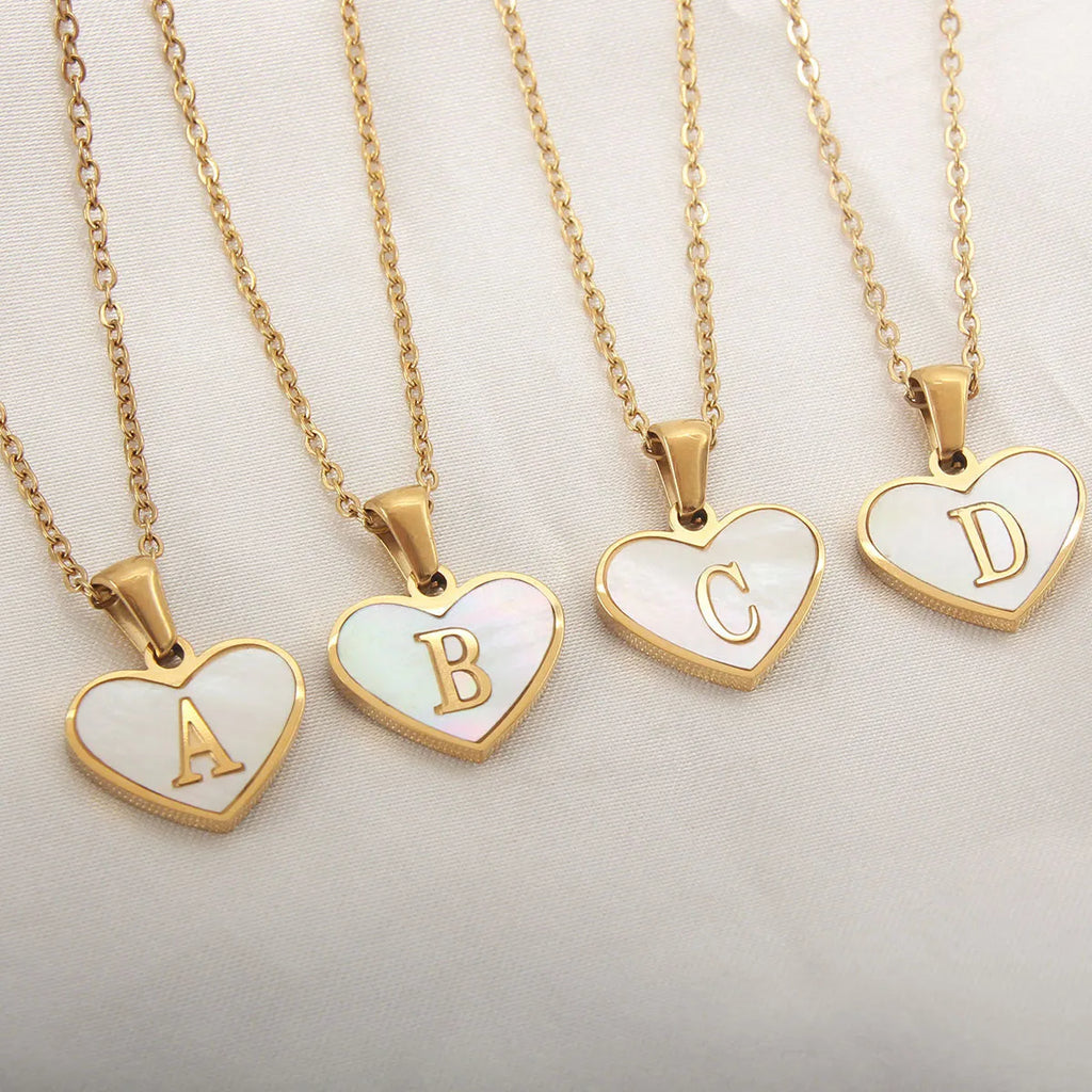 Gold-plated heart necklace with white shell design on adjustable stainless steel chain