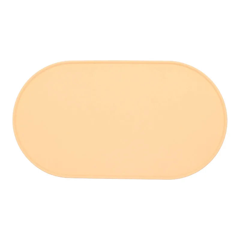 Silicone cat feeding placemat in beige showing food and water bowl placement