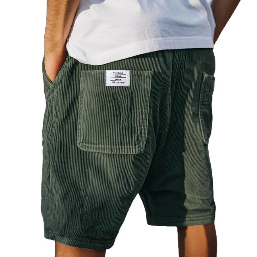 Men's grey straight-fit corduroy shorts with multiple pockets and a small embroidered logo on the leg.