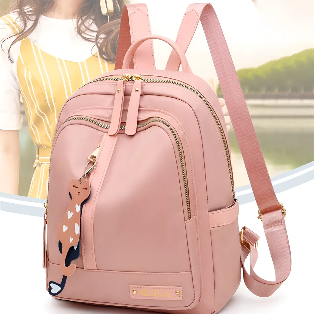 Women's black casual nylon backpack with shoulder straps showing external pockets and organised interior compartments