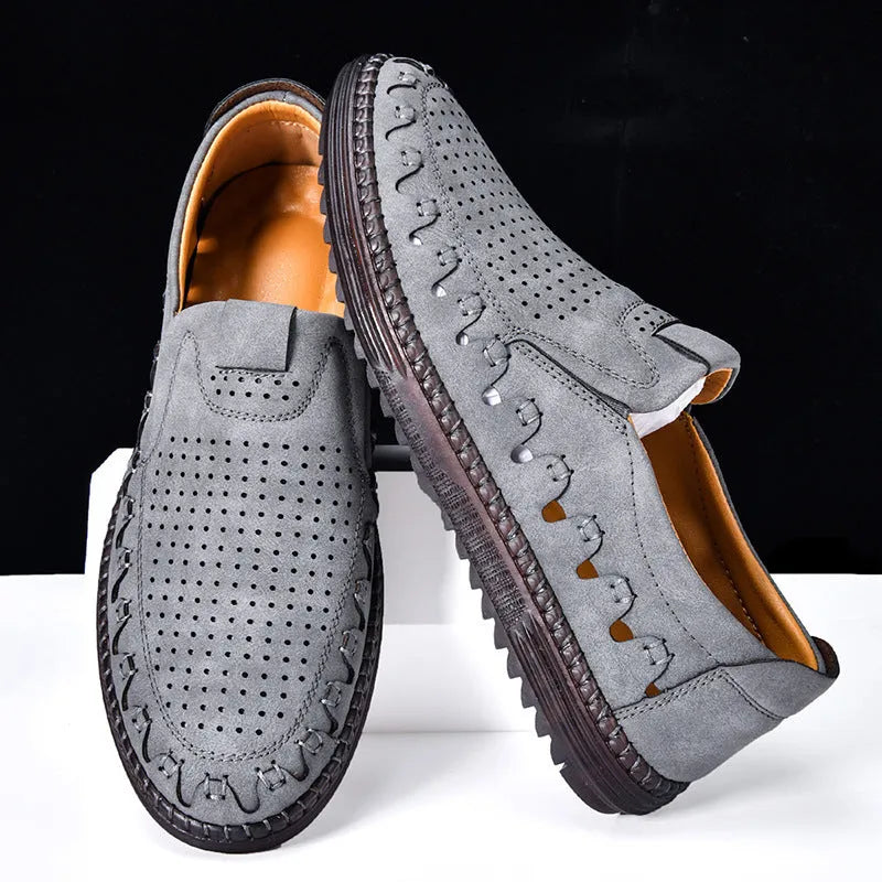 Men's brown slip-on casual shoes with round toe and flat heel on a white background