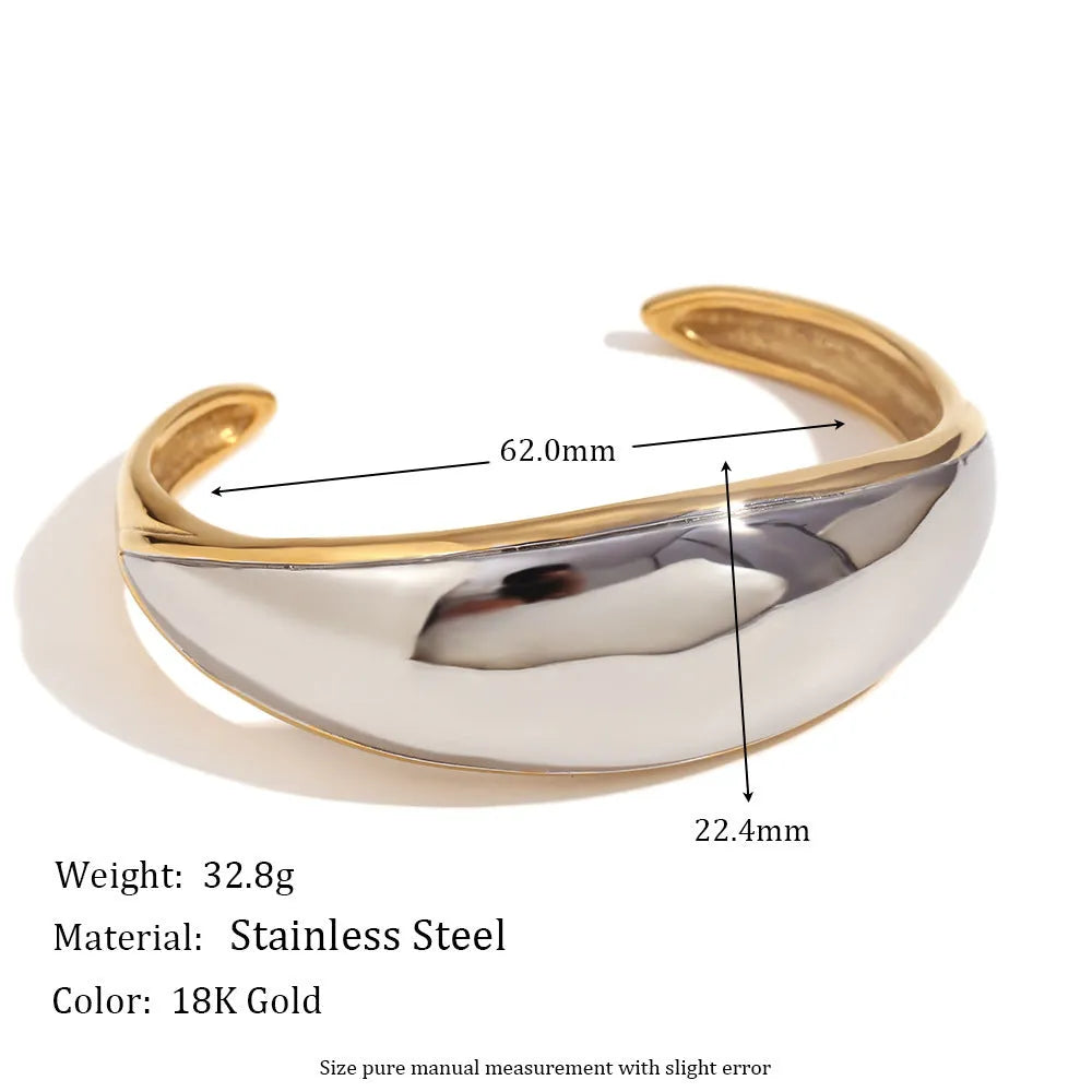 Gold geometric stainless steel earrings, bracelet, and necklace set on a white background.