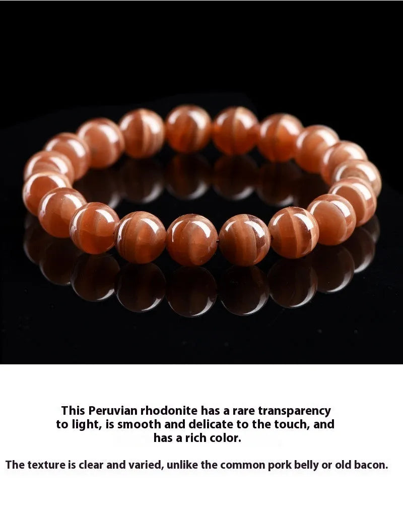 Natural old mine rhodochrosite round bead bracelet with geometric design and Ruyi elements.