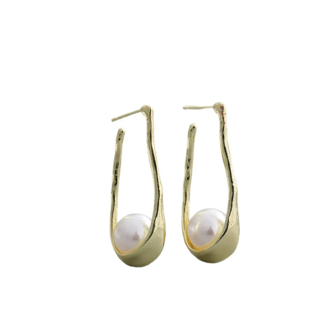 Gold-tone hook earrings with an irregular natural pearl in a vintage European style