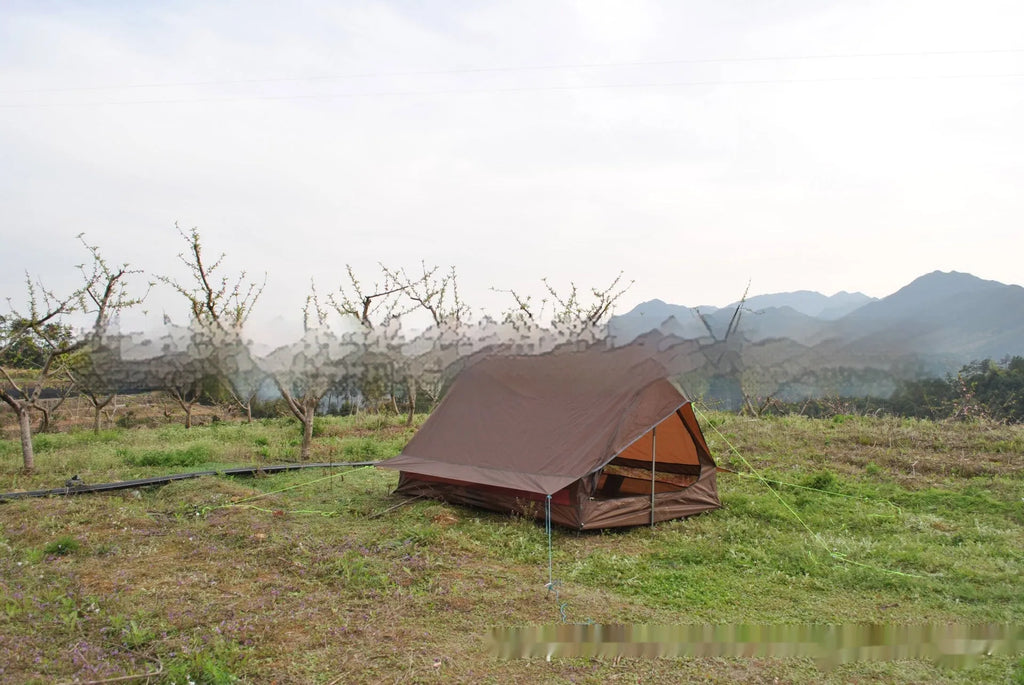 Brown or white A-line pole-free cabin tent for hiking, shown packed and pitched.