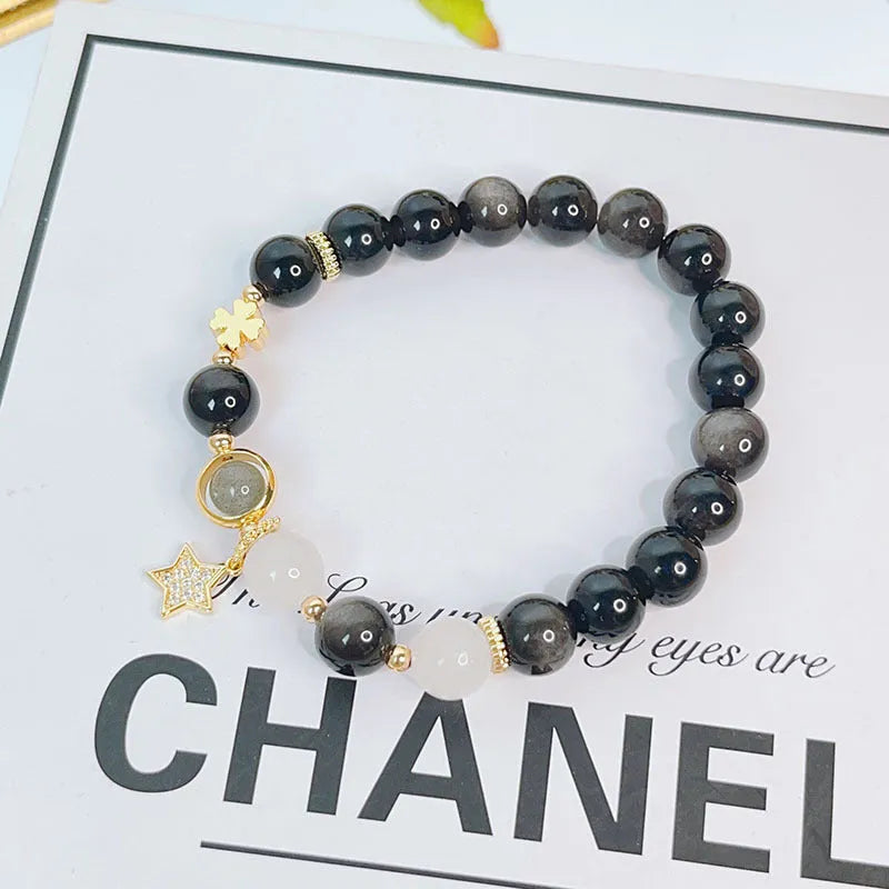 Silver stone bracelet for women with electroplated finish showing flower, love heart and star charm options