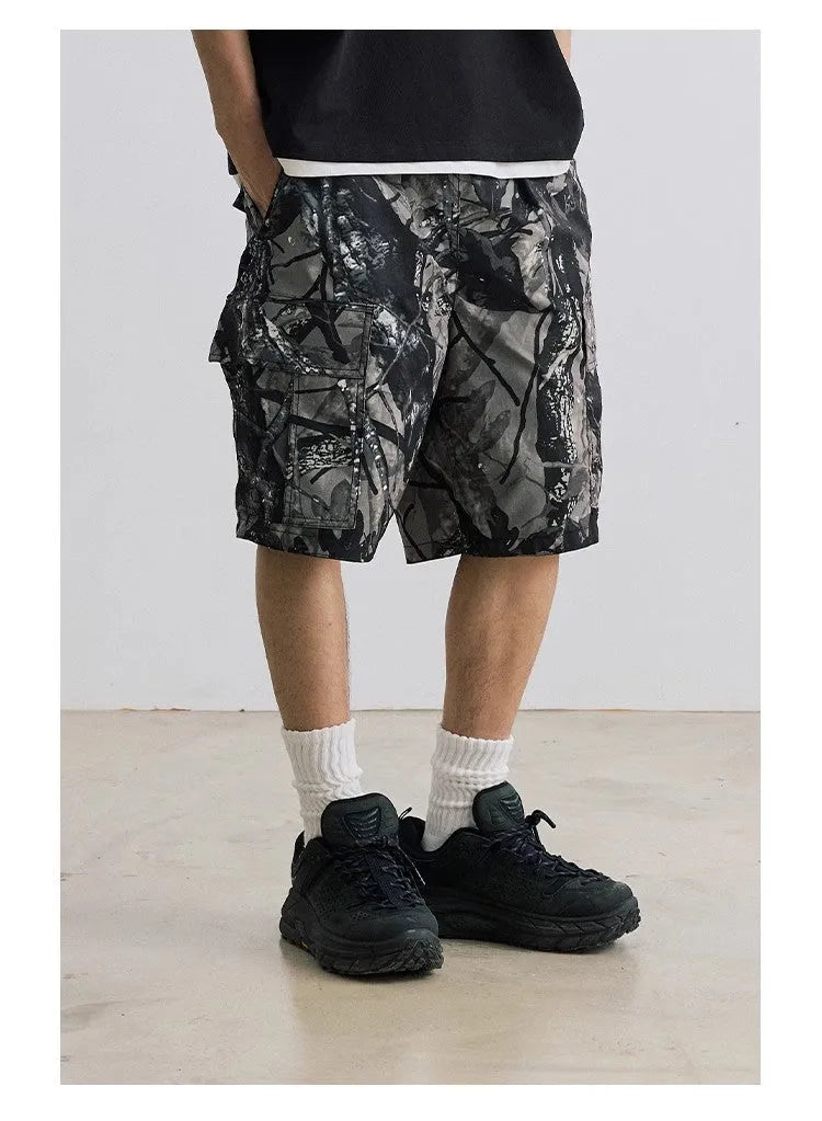 Men's loose fit straight-leg denim shorts in army green colour with a mid waist and zip fly.