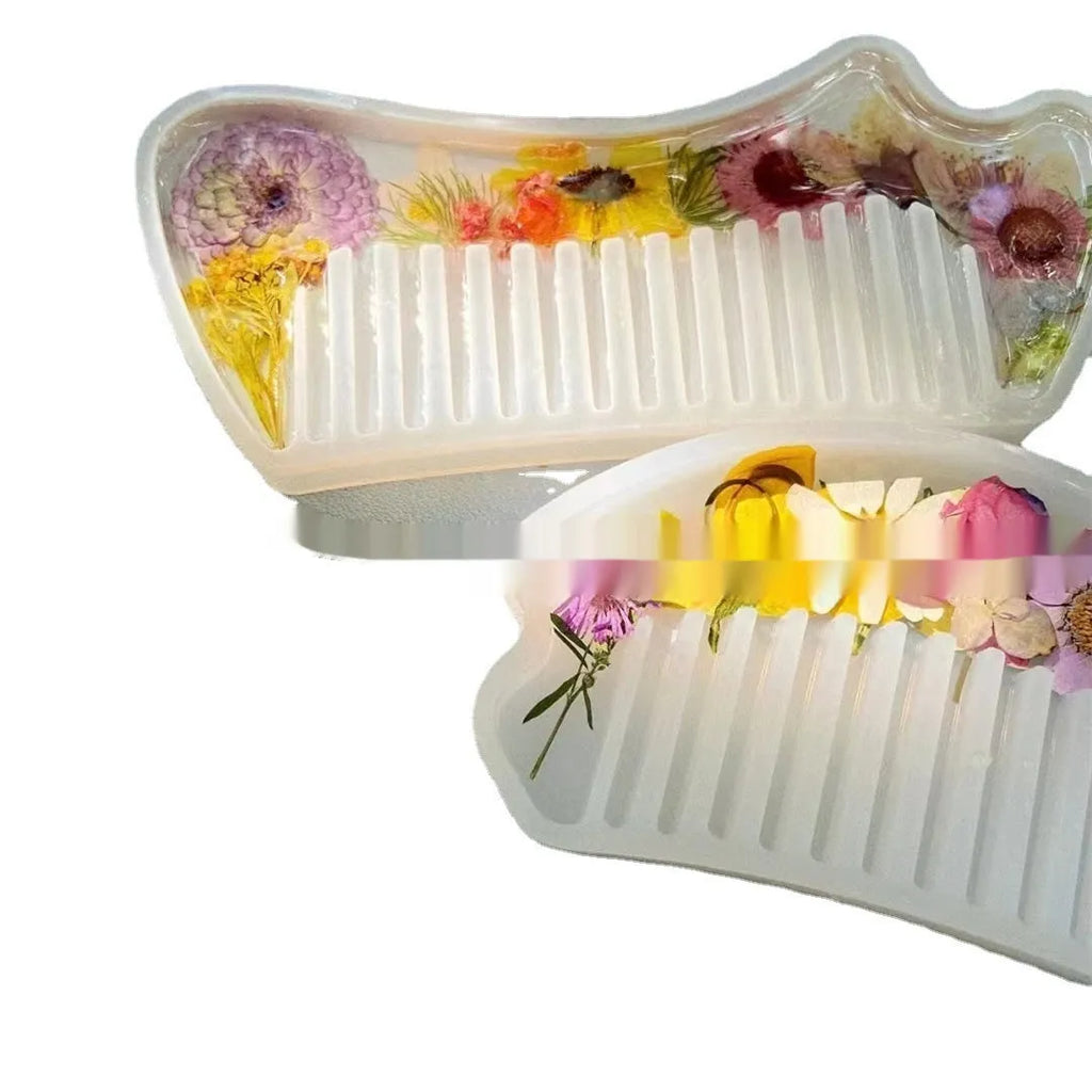 Small glossy resin hair comb with a reflective mirror finish, shown in one of three colour options.
