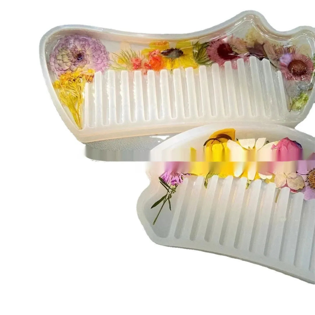 Small glossy resin hair comb with a reflective mirror finish, shown in one of three colour options.