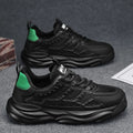 Men's solid colour casual shoes with breathable PU mesh upper and round toe in black and white.