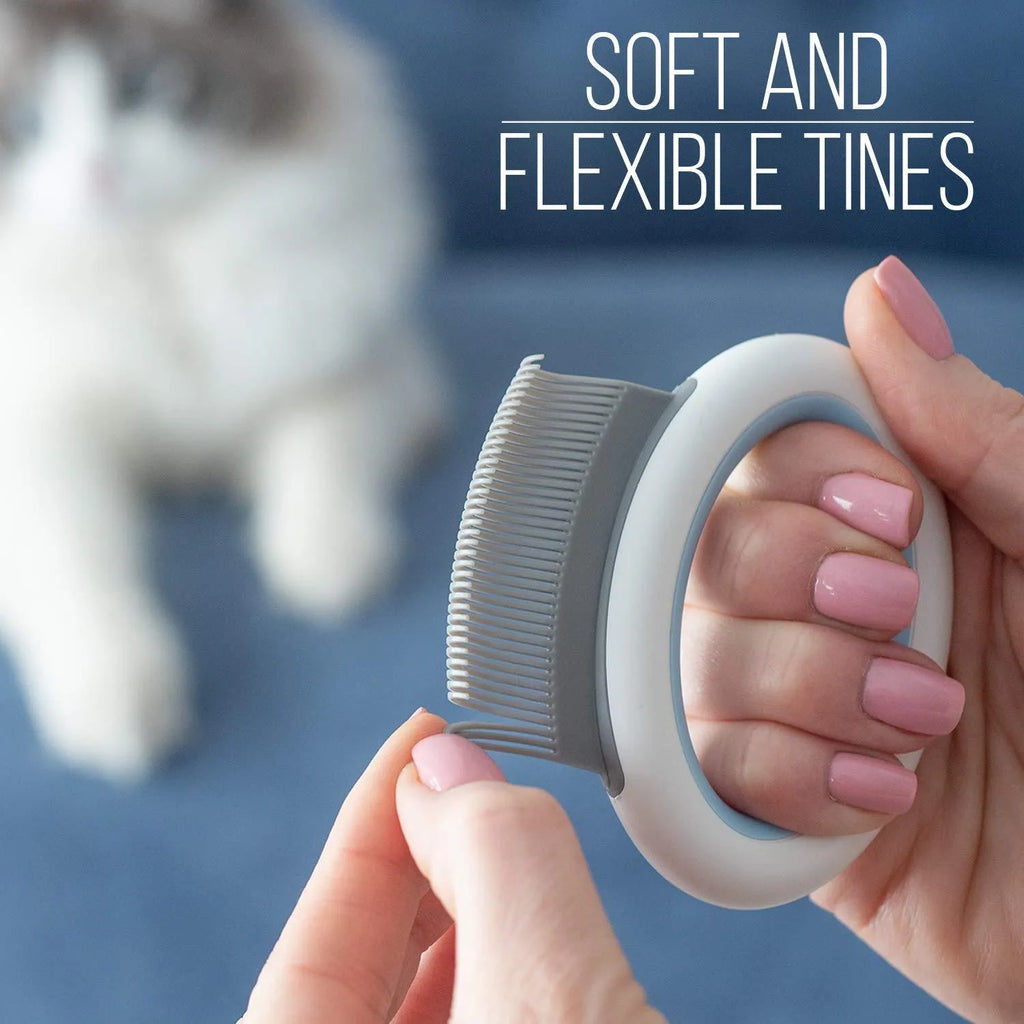 Blue plastic pet grooming comb for deshedding and dematting cat and dog hair on a white background.