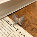 Copper butterfly women's ring with oil-drip finish showing open-loop design