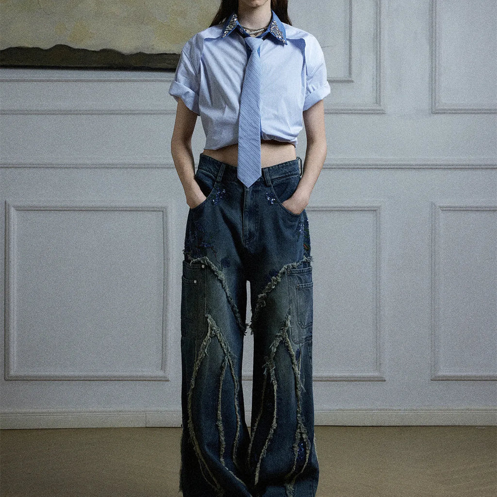 Man's blue patchwork striped shirt with a diamond tie front, quilted panels, and button decorations.