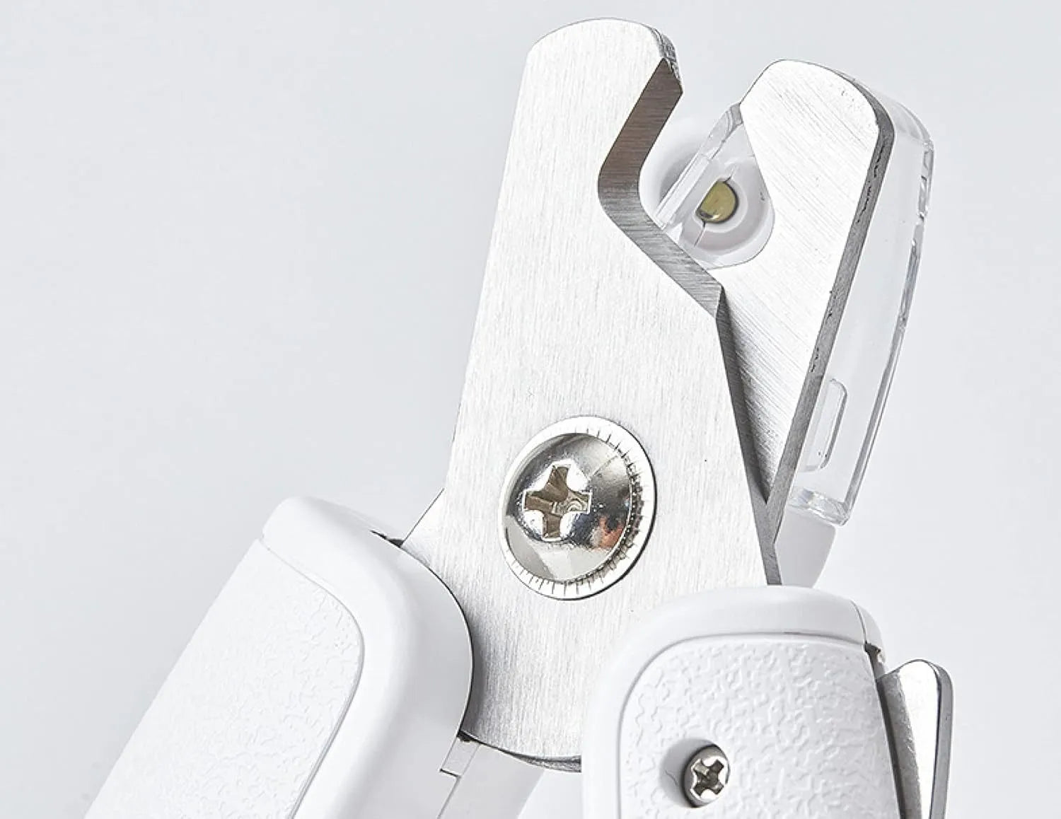 White LED pet nail clipper with a triangular blade, anti-splash guard, and leatherette handle.