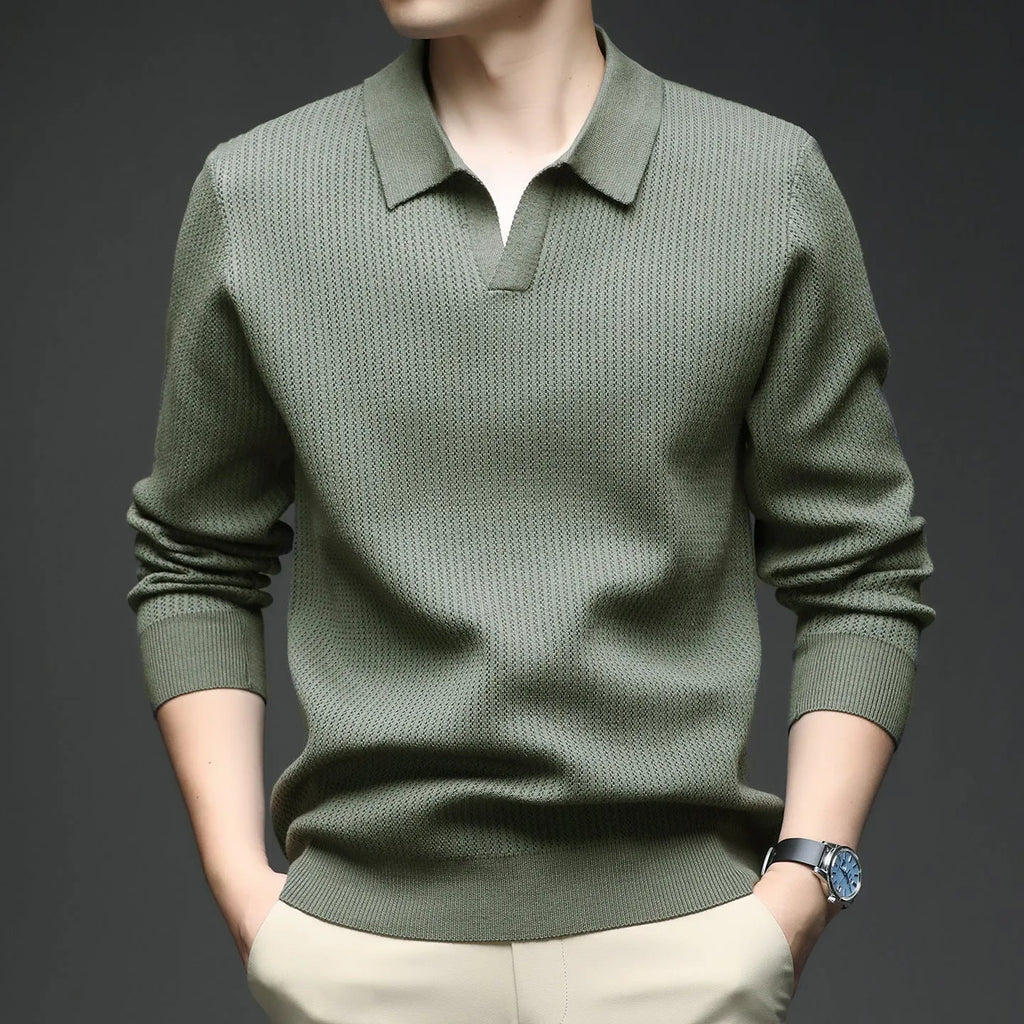 Men's loose green pullover sweater on a hanger, casual autumn wear