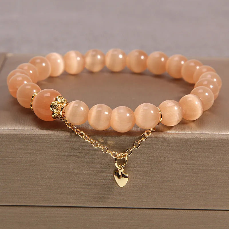 Natural garnet multi-layer crystal bracelet with strawberry quartz, moonstone, and pendant details in Korean light luxury style