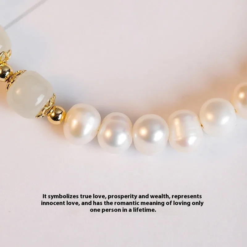 Natural freshwater pearl bracelet with diamond-shaped beads in Hetian jade colour on wrist