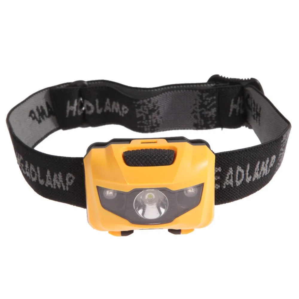 A black waterproof head torch with a central white LED and two smaller red LEDs, mounted on an adjustable headband.