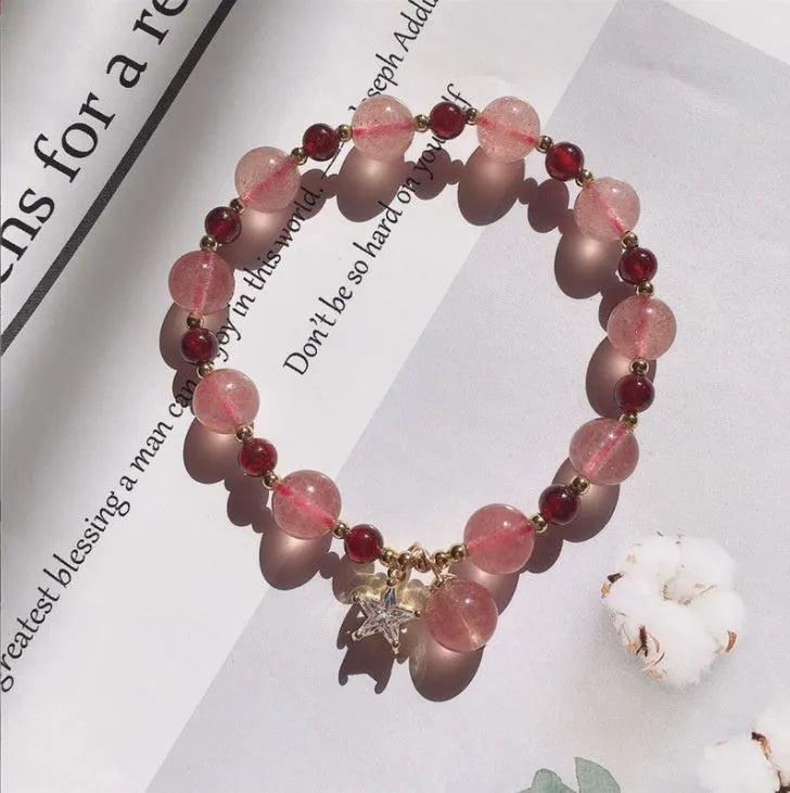 Hetian jade and strawberry quartz crystal bracelet for women showing manual craftsmanship and natural stone variations