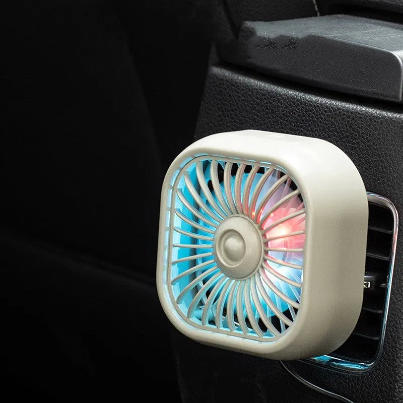 Compact black USB car fan with three speed buttons and charging cable
