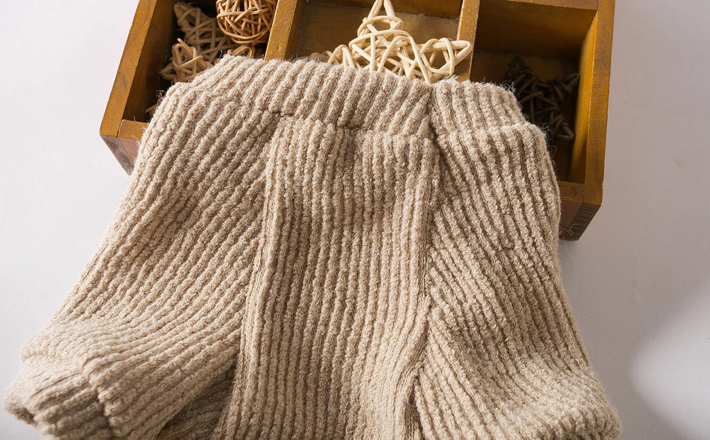 Brown cloth pullover sweater on a small dog, showing casual style and fit for breeds like Bichon or Pomeranian.