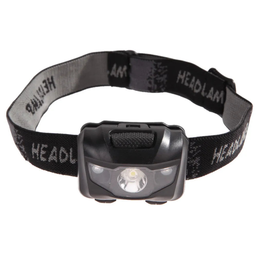 A black waterproof head torch with a central white LED and two smaller red LEDs, mounted on an adjustable headband.