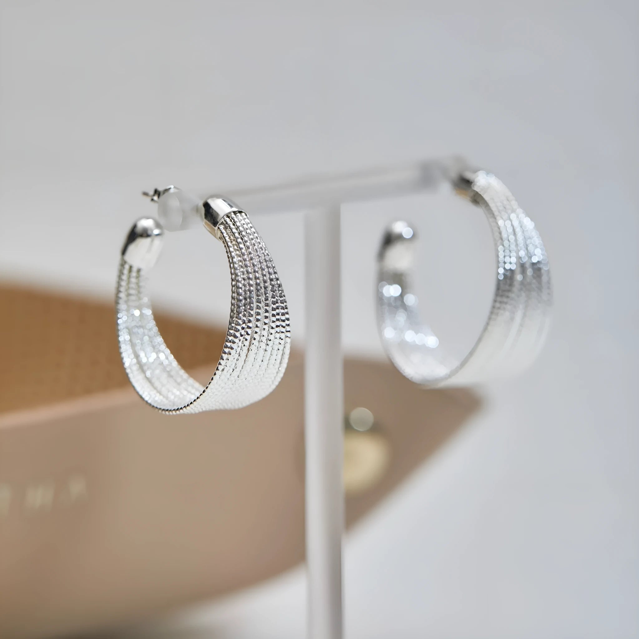 Geometric multi-layer simple bracelet earrings in gold and silver finishes with copper construction
