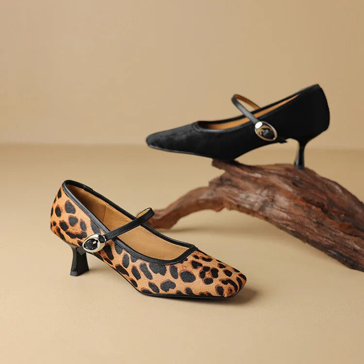 Women's black square toe stiletto ankle-strap heels with a horse hair upper and buckle closure.
