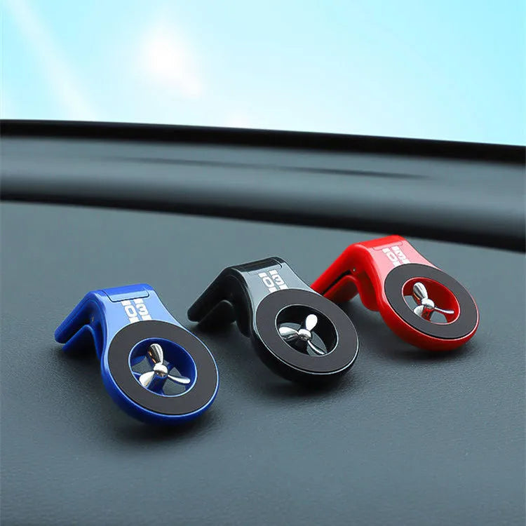 Black magnetic car air vent phone holder with adjustable rotation paddle showing phone mounting position