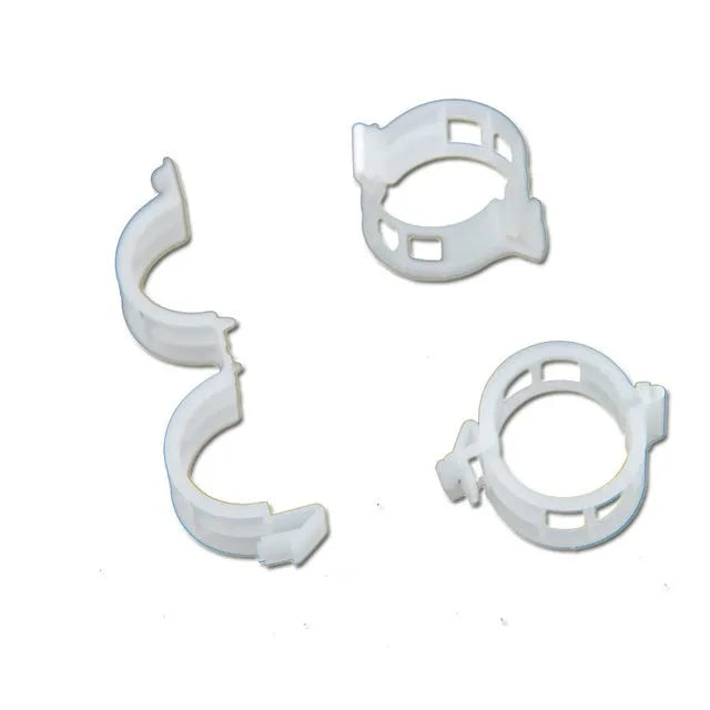 Assortment of 50 smooth plastic plant grafting clips for garden use on a white background.