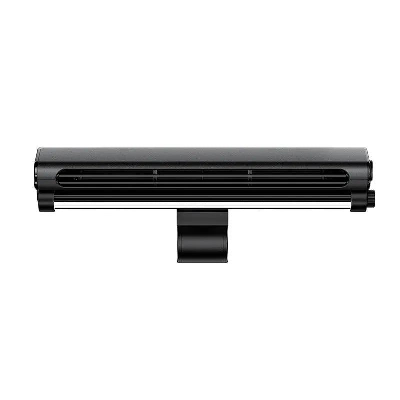 Black bladeless USB fan with light clipped to top of a laptop screen.