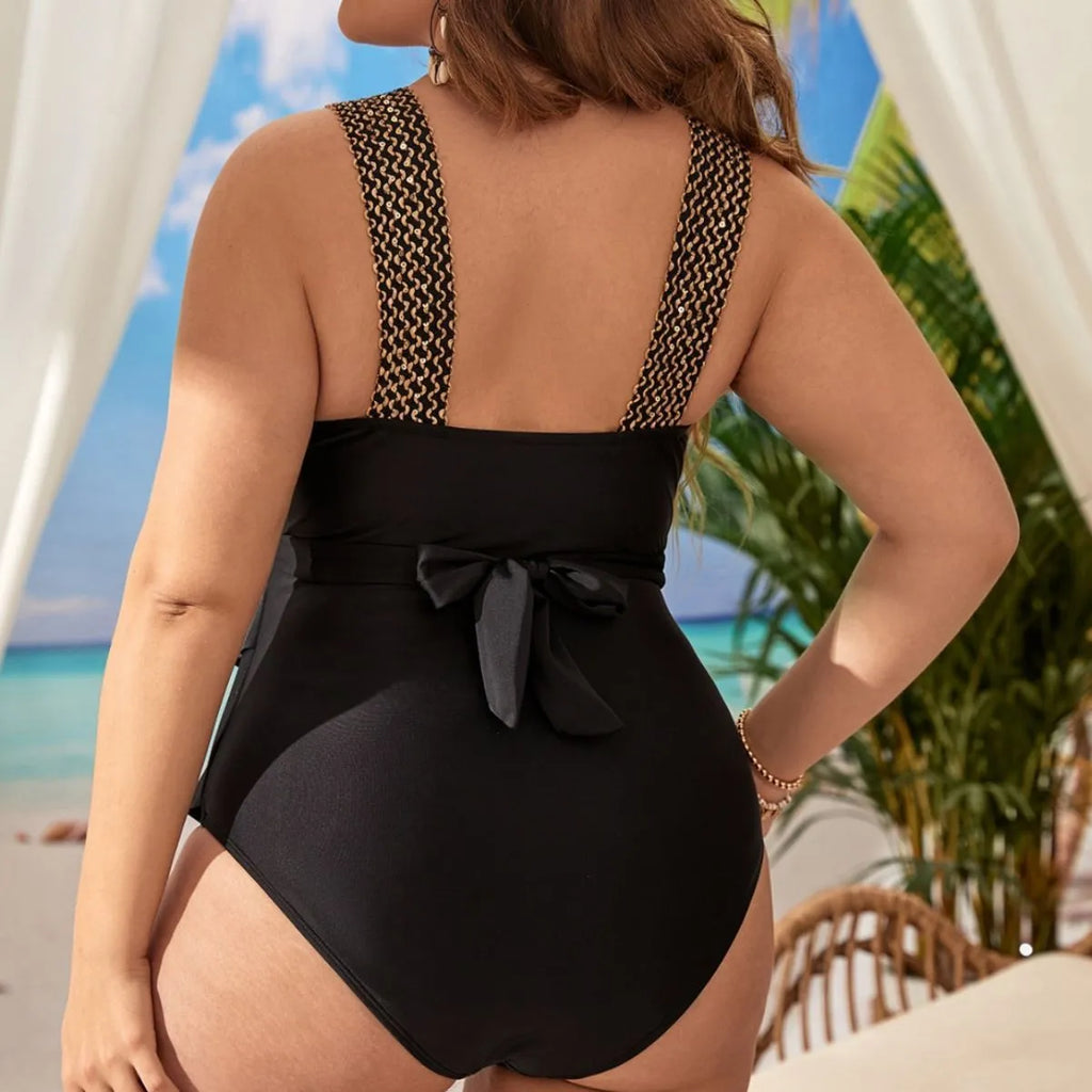 Women's black one-piece swimsuit with chest padding and sleeveless design for swimming