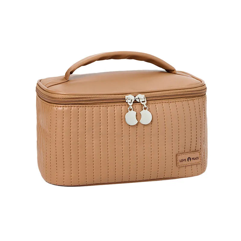 Open-top solid colour PU leather makeup bag in light blue on a white surface