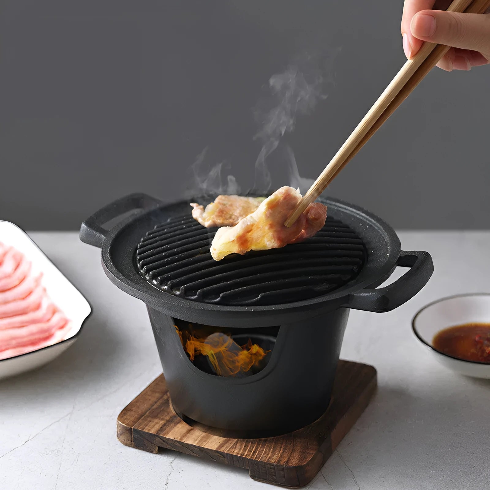 Mini BBQ grill alcohol stove with double-head flame and non-stick plate on tabletop
