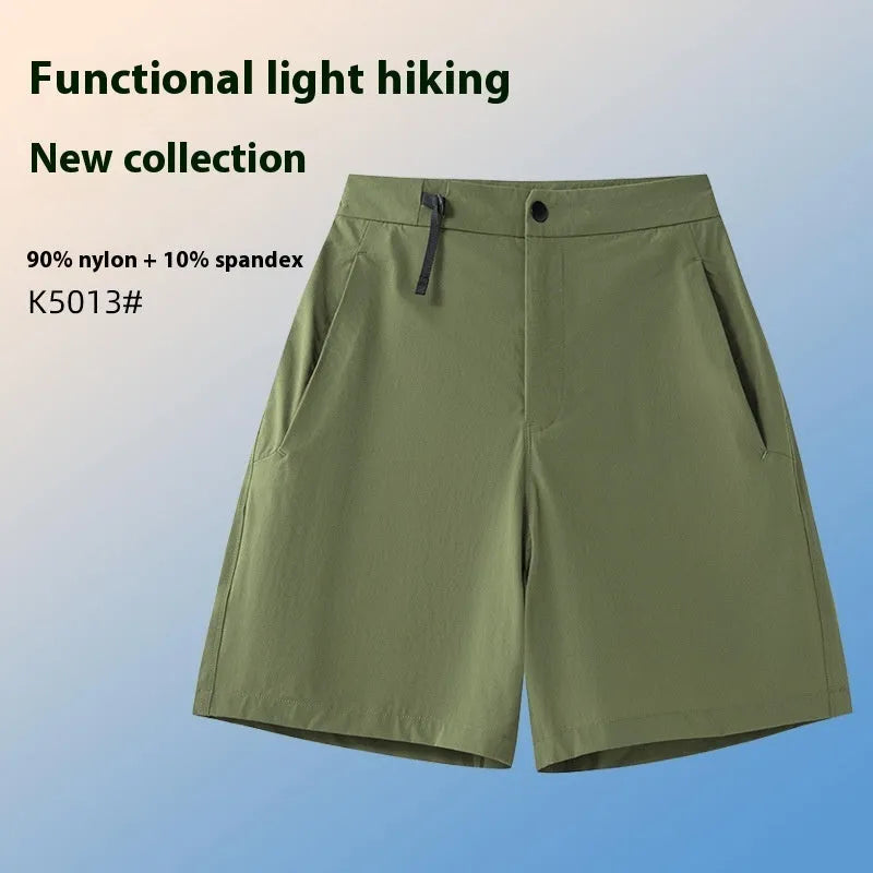 Men's solid colour quick-dry sports shorts with elastic sides on a neutral background.