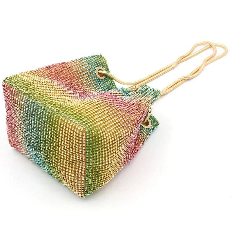 Colourful rhinestone bucket bag with glittery crystal embellishment and soft fabric construction