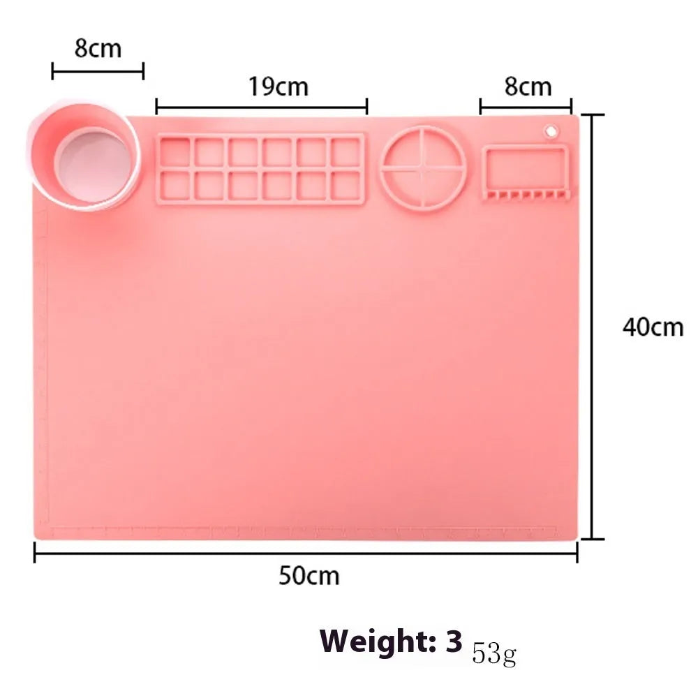 Light blue silicone painting mat with two built-in mixing bowls for graffiti and watercolour art.