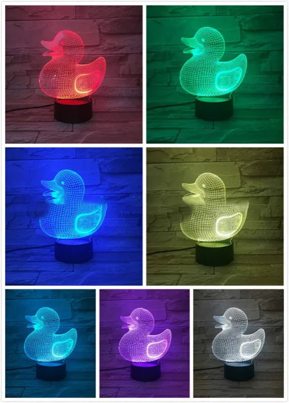 Yellow duck cartoon 3D night light table lamp with remote control on a table.