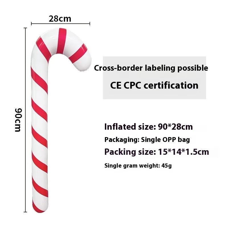 Large red and white inflatable Christmas ball with flashing lights in a garden setting.