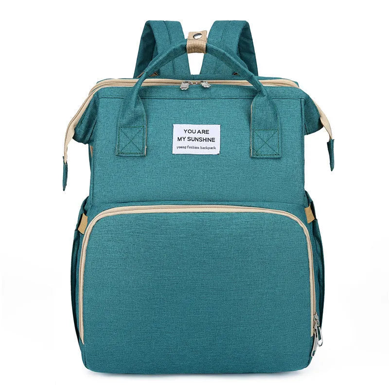 Portable lightweight nylon folding baby changing bag with USB port and shoulder strap in selected colour.