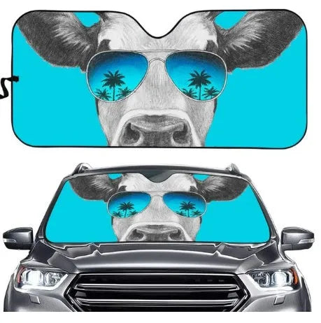 Telescopic aluminium foil car sun visor extended across a vehicle windshield