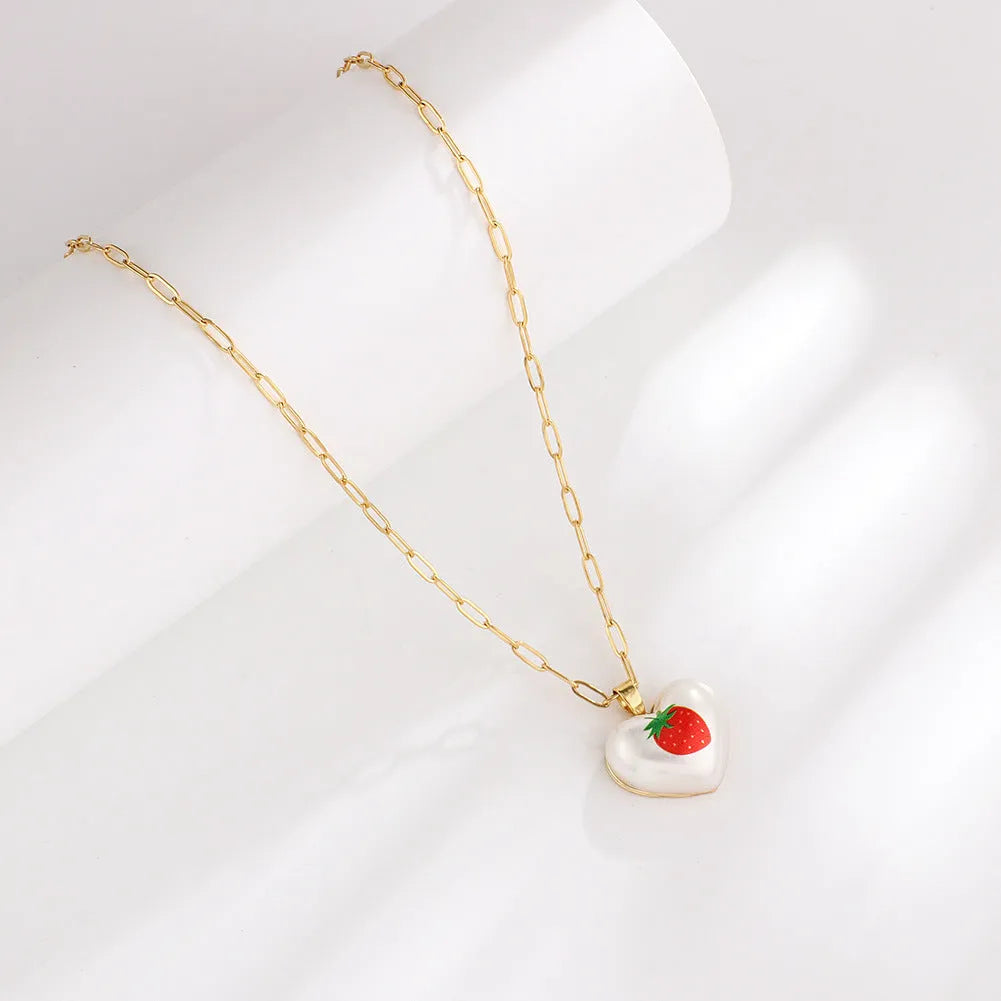 Fruit charm necklace with adjustable chain showing strawberry, pineapple, apple, pear and cherry pendant options