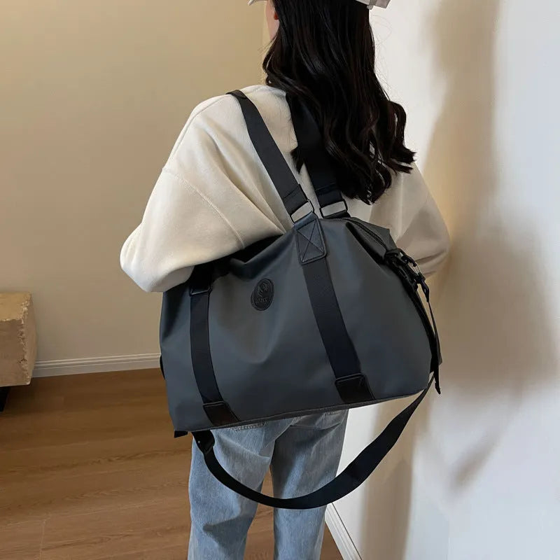 Large waterproof Oxford cloth travel bag in black colour with 36-55L capacity for short-distance leisure travel