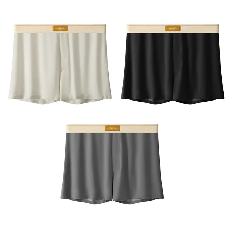 Men's solid colour loose ice silk underwear in a pack of three, shown in beige, black, and grey.