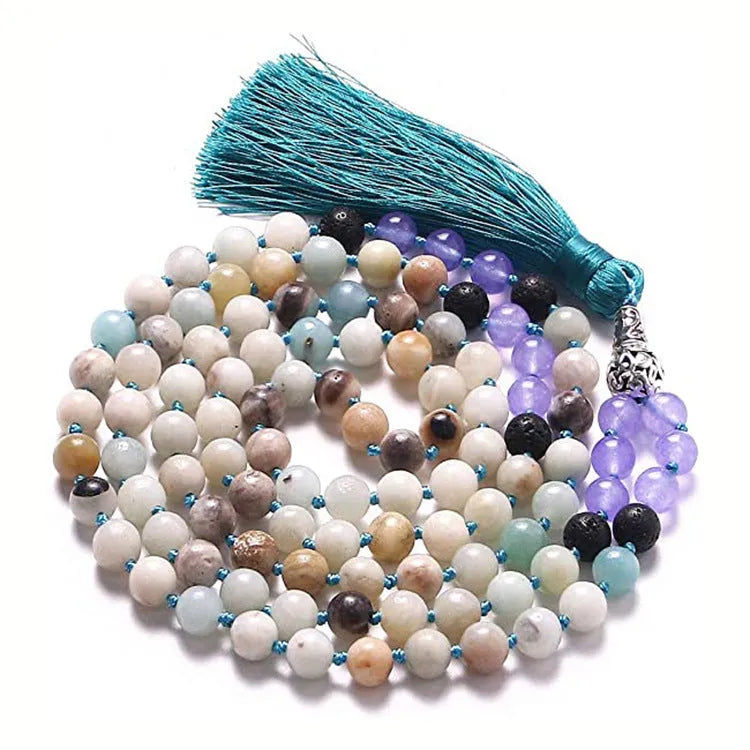 Long geometric agate and gemstone tassel necklace with blue, purple, and multi-coloured beads on a black background.