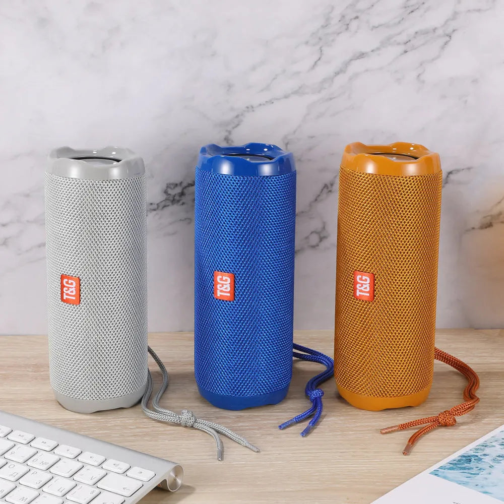 Blue portable Bluetooth speaker with a fabric card holder on the front
