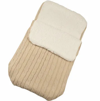 Envelope-style baby stroller sleeping bag in a choice of colours with cotton wool filling.